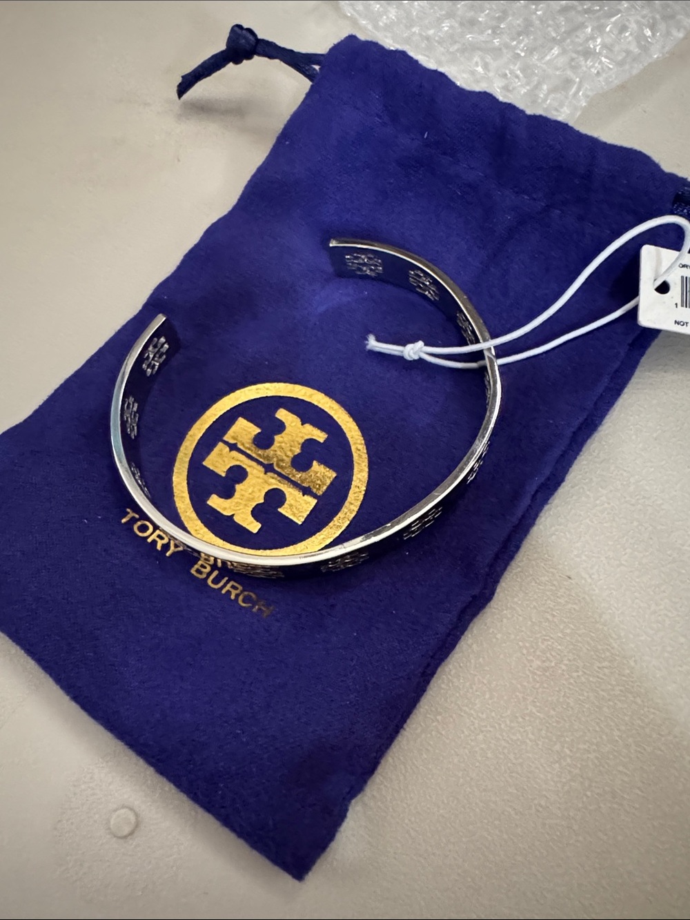 TORY BURCH LOGO HOLLOW BRACELET SILVER